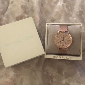 Brand new never used MK rose gold watch with tags
